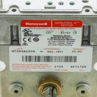Alternate angle of Honeywell M7284A1004 actuator label with visible model number and electrical specifications.