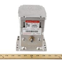 The M7284C1000 actuator shown at an angle, highlighting its housing, dual shafts, and mounting design