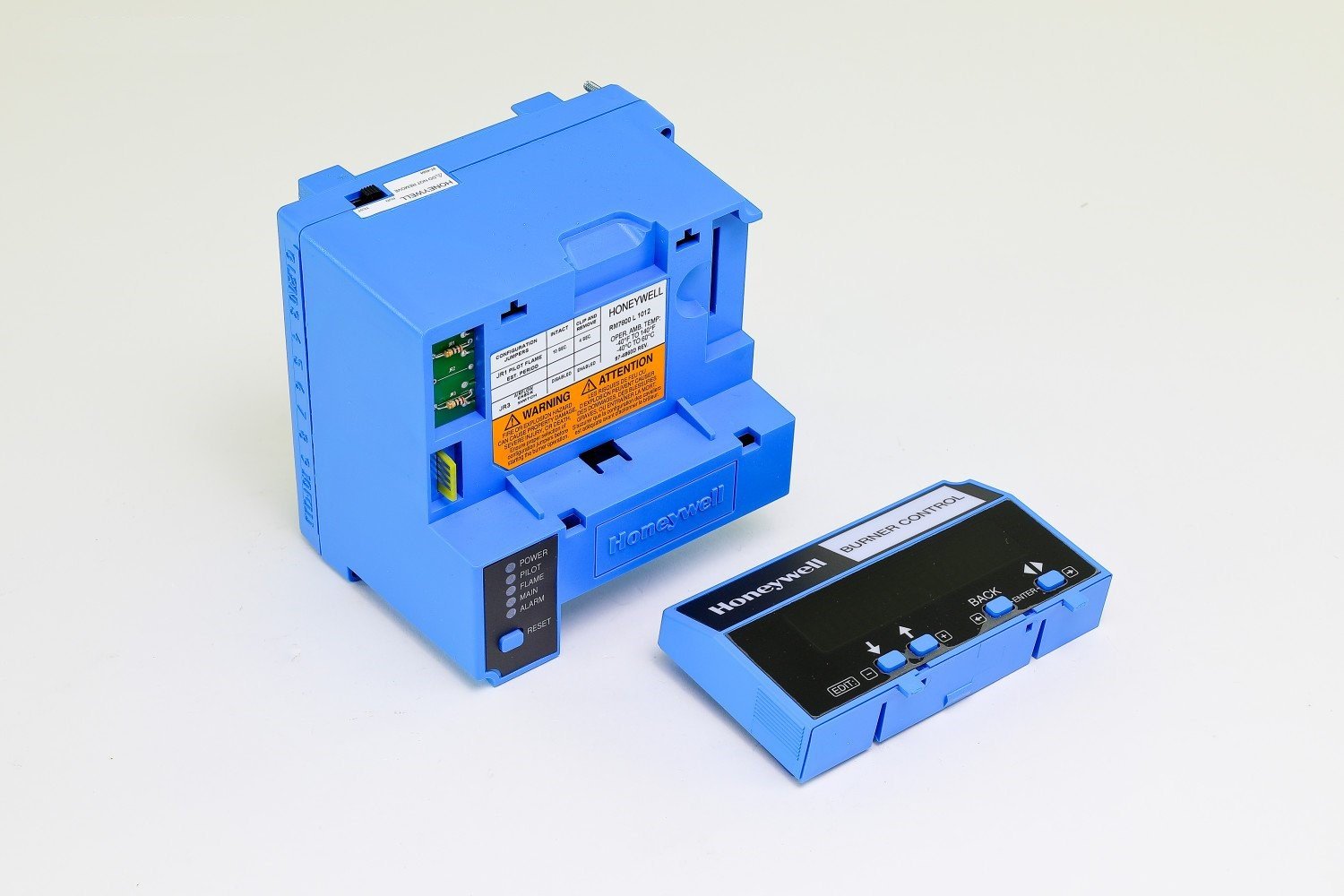 Honeywell RM7800L1012 burner control module angled view with detached S7800A1001
